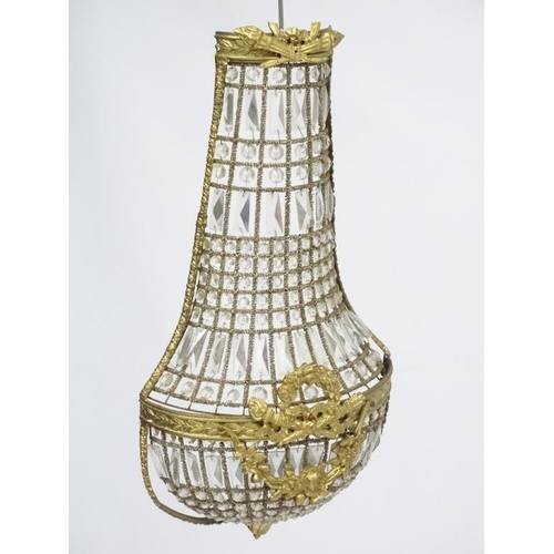 252 - A 20thC Continental Regency style glass luster wall shade of  basket shape. Approx 27'' high