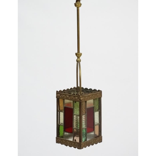 253 - An Edwardian brass and leaded stained glass multicoloured pendant wall lantern / light shade. The wh... 