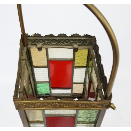 253 - An Edwardian brass and leaded stained glass multicoloured pendant wall lantern / light shade. The wh... 