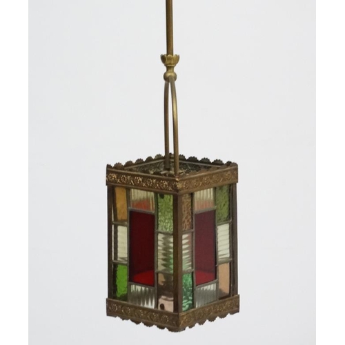 253 - An Edwardian brass and leaded stained glass multicoloured pendant wall lantern / light shade. The wh... 