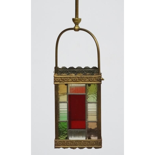 253 - An Edwardian brass and leaded stained glass multicoloured pendant wall lantern / light shade. The wh... 