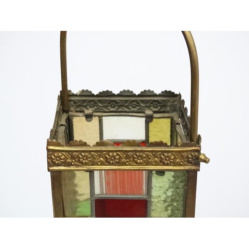 253 - An Edwardian brass and leaded stained glass multicoloured pendant wall lantern / light shade. The wh... 