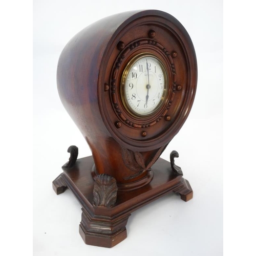 255 - Propeller Boss Clock : a mahogany cased barrel movement clock ( timepiece ) with platform escapement... 