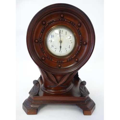 255 - Propeller Boss Clock : a mahogany cased barrel movement clock ( timepiece ) with platform escapement... 