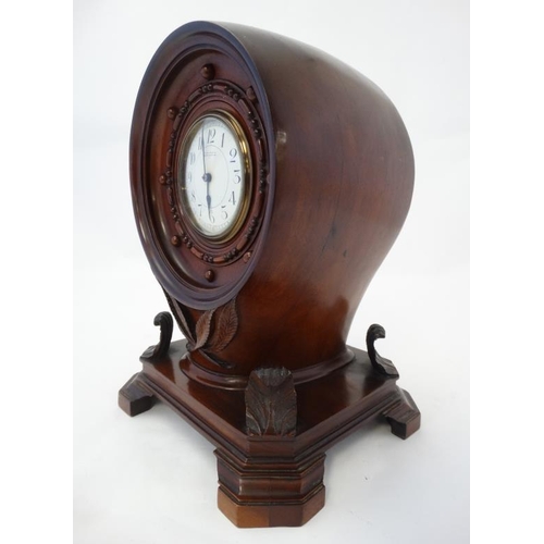 255 - Propeller Boss Clock : a mahogany cased barrel movement clock ( timepiece ) with platform escapement... 