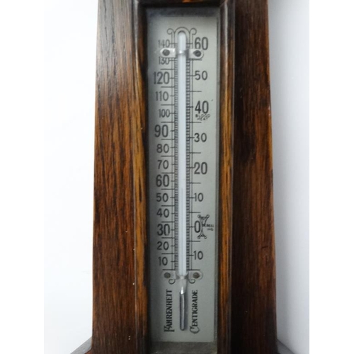 269 - Oak 2 glass wall Barometer : an aneroid barometer and Farenheit / Centrigrade thermometer with carvi... 