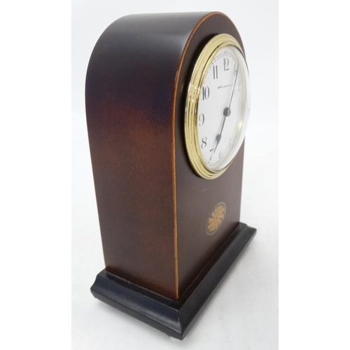 288 - Edwardian Mahogany Mantle Clock : an arched shaped cased Mahogany mantle clock ( timepiece ) with si... 