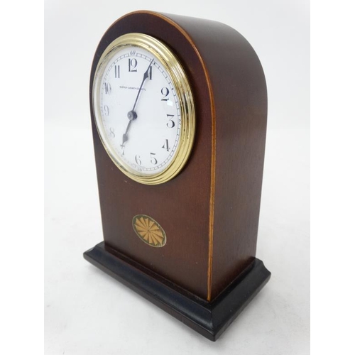 288 - Edwardian Mahogany Mantle Clock : an arched shaped cased Mahogany mantle clock ( timepiece ) with si... 