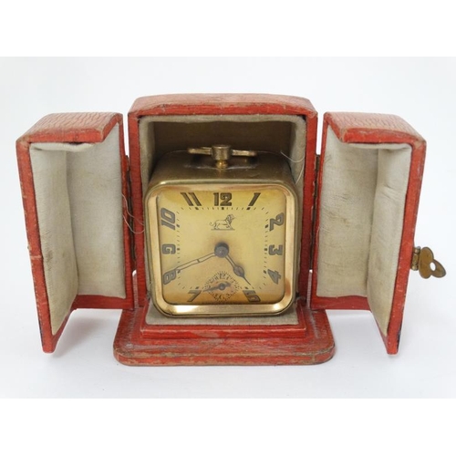 289 - Duverdrey & Bloque Cased alarm clock : an Art Deco square leather cased (and silk lined ) with Arabi... 