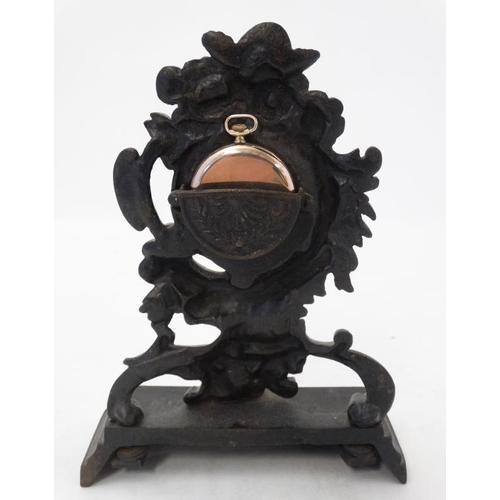 293 - 19thC Cast Iron Rococo pocket watch stand and gold pocket watch : a 9 (.375) gold cased Swiss Top Wi... 