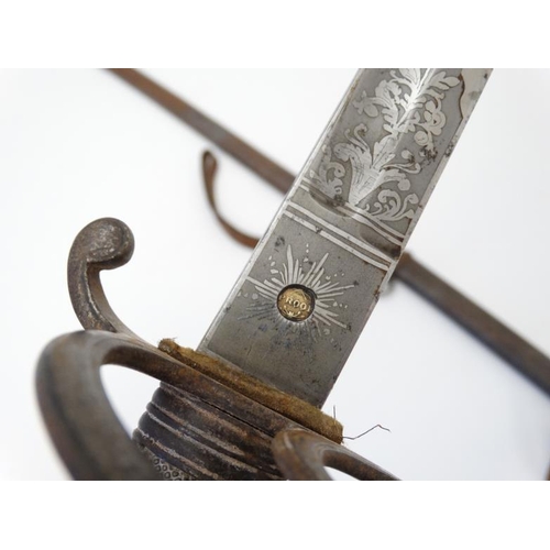 309 - Militaria : An 1845 pattern Infantry Officer's sword , having a 33'' blade decorated with foliate an... 