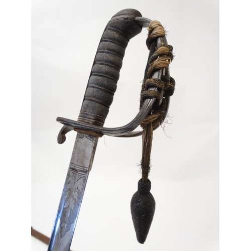 309 - Militaria : An 1845 pattern Infantry Officer's sword , having a 33'' blade decorated with foliate an... 