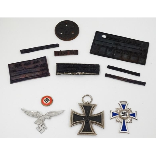 322 - Militaria : A collection of Third Reich items , to include a Cross of Honour of the German Mother ( ... 