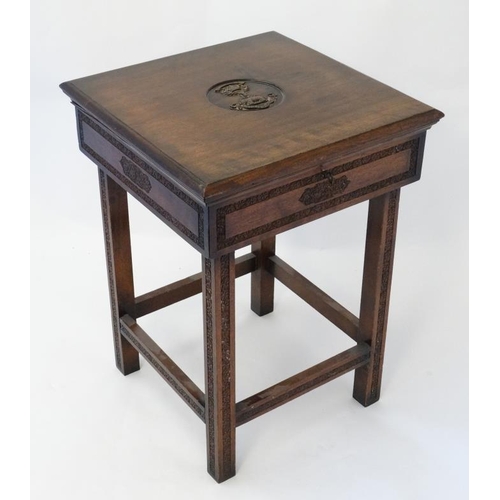 325 - Militaria : An unusual small work table , the hinged lidded top carved with the insignia of the Ross... 