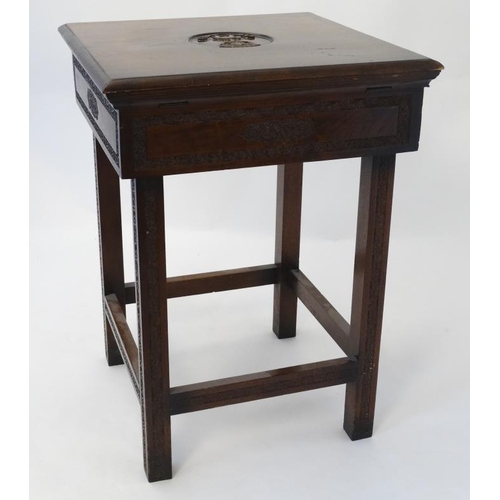 325 - Militaria : An unusual small work table , the hinged lidded top carved with the insignia of the Ross... 