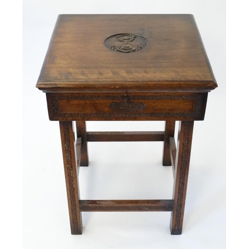 325 - Militaria : An unusual small work table , the hinged lidded top carved with the insignia of the Ross... 