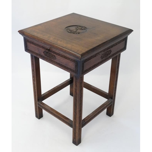 325 - Militaria : An unusual small work table , the hinged lidded top carved with the insignia of the Ross... 