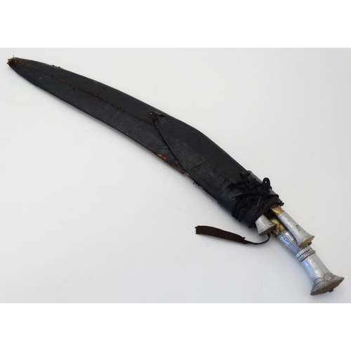 327 - Militaria : An early 20thC unusually large Nepalese Kukri knife , 22'' blade with a 5'' brass and wh... 