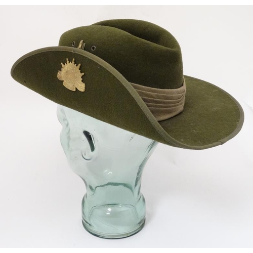 331 - Militaria : A late 20thC Australian ' Slouch Hat ' having applied sunburst badge to the upturned bri... 