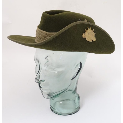 331 - Militaria : A late 20thC Australian ' Slouch Hat ' having applied sunburst badge to the upturned bri... 