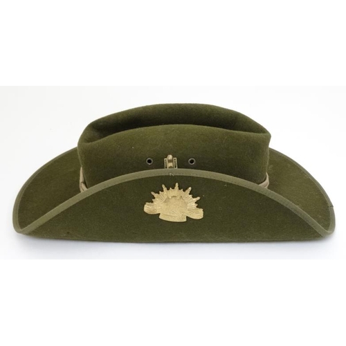 331 - Militaria : A late 20thC Australian ' Slouch Hat ' having applied sunburst badge to the upturned bri... 