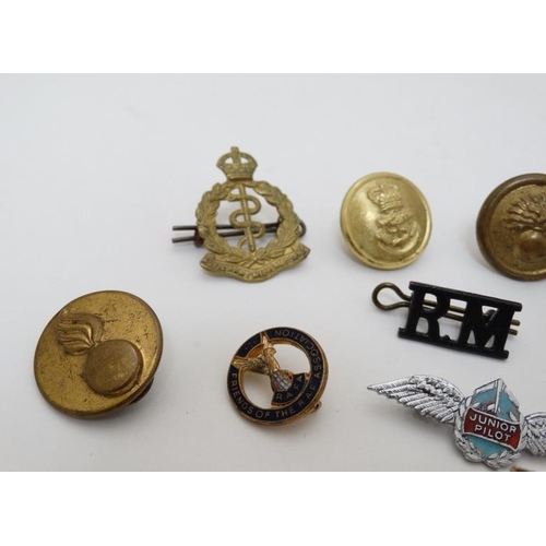 335 - Militaria : A collection of military dress badges , to include Royal Marines , Royal Army Ordinance ... 