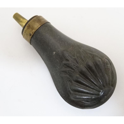 336 - Shooting : A 19thC pewter Pistol Powder Flask , having sunburst decoration and brass cap . 4 1/4'' l... 