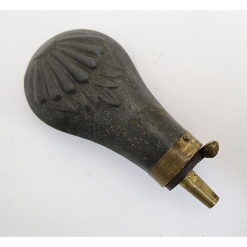 336 - Shooting : A 19thC pewter Pistol Powder Flask , having sunburst decoration and brass cap . 4 1/4'' l... 