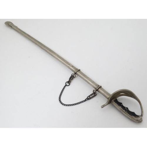 340 - Militaria : A novelty Letter Opener formed as an British Army Officer's sword , together with scabba... 