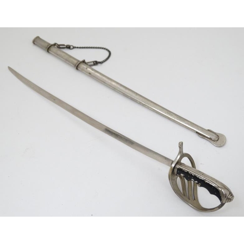 340 - Militaria : A novelty Letter Opener formed as an British Army Officer's sword , together with scabba... 