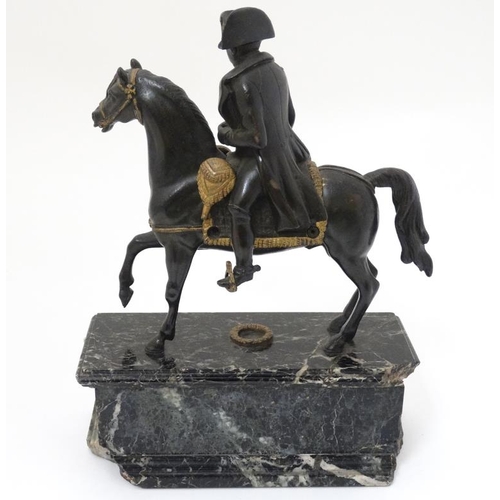 349A - Militaria : A bronze sculpture depicting Napoleon Bonaparte on horseback , affixed to a marble base ... 