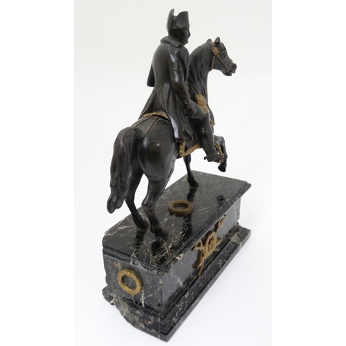 349A - Militaria : A bronze sculpture depicting Napoleon Bonaparte on horseback , affixed to a marble base ... 