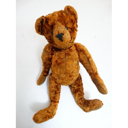 386 - Toy: A late 20thC cinnamon coloured Teddy bear having black stitched nose , fabric pads, plastic sho... 