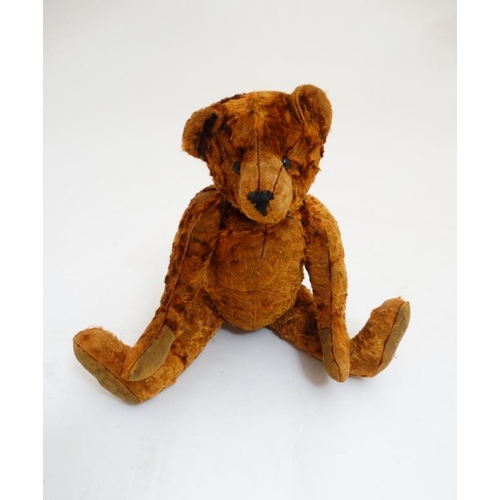 386 - Toy: A late 20thC cinnamon coloured Teddy bear having black stitched nose , fabric pads, plastic sho... 