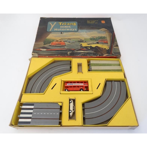 392 - Toy: A 1960s Tri-ang Minic motorway, number M1501C with double decker bus, in original box.