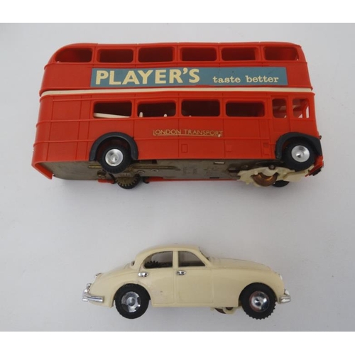 392 - Toy: A 1960s Tri-ang Minic motorway, number M1501C with double decker bus, in original box.