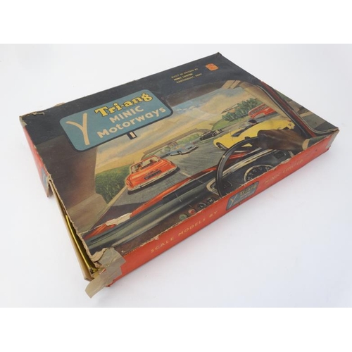 392 - Toy: A 1960s Tri-ang Minic motorway, number M1501C with double decker bus, in original box.