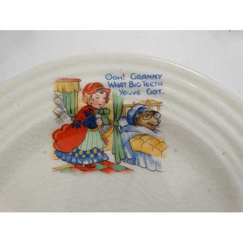 393 - Toy: a c1950s Child's toy '' Little Red Riding Hood '' tea set , comprising teapot, milk jug, 2 cups... 