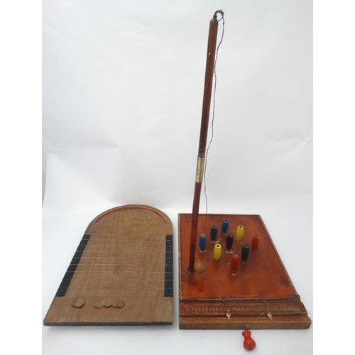 396 - Toys: A mid 20thC wooden table skittles board with integral score board and gilt coloured numbers to... 