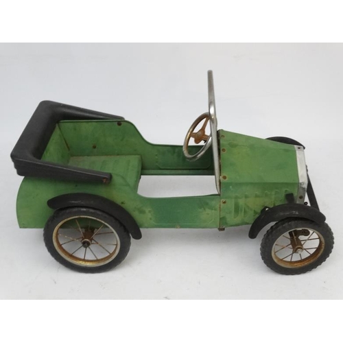 398 - A Child's metal pedal car in British Racing Green by Great Gizmos Ltd, modelled after a 1931 MG , wi... 