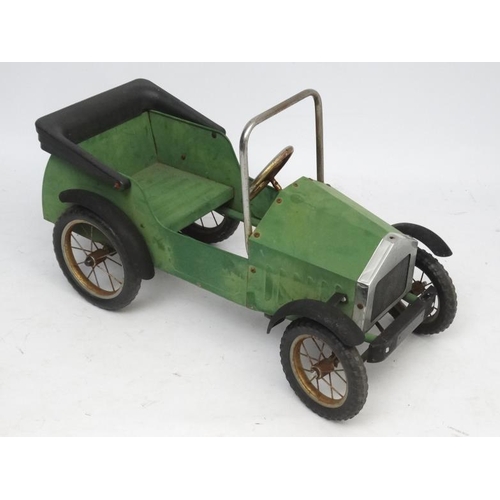 398 - A Child's metal pedal car in British Racing Green by Great Gizmos Ltd, modelled after a 1931 MG , wi... 