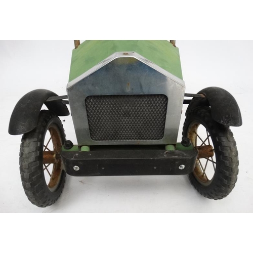 398 - A Child's metal pedal car in British Racing Green by Great Gizmos Ltd, modelled after a 1931 MG , wi... 