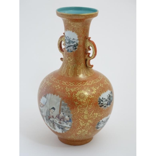 402 - An early 20thC burnt orange twin handled bottle vase , having decorative panels with figures and lan... 