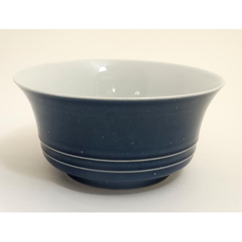 413 - A Chinese cobalt blue bowl with white interior and raised bands to sides, bears blue Chinese 6 chara... 