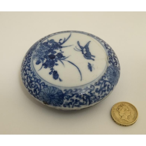 419 - A Chinese blue and white ink box and cover , decorated with butterflies and flowers to lid amid a sc... 