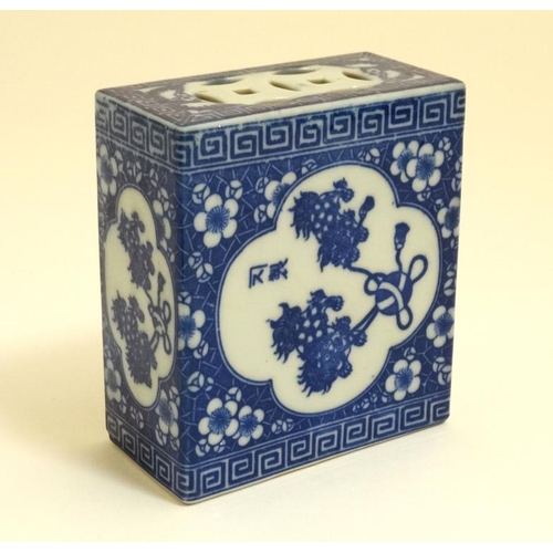 421 - A Chinese pierced blue and white flower brick/grasshopper box with stylised foliate decoration. With... 