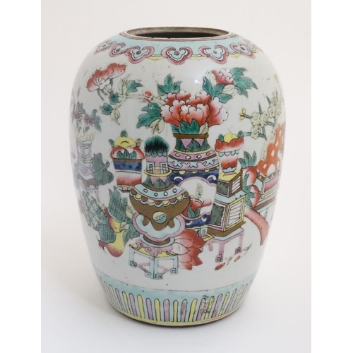 428 - A Chinese famille rose ginger jar, decorated in polychrome with flowers and fruit in a selection of ... 