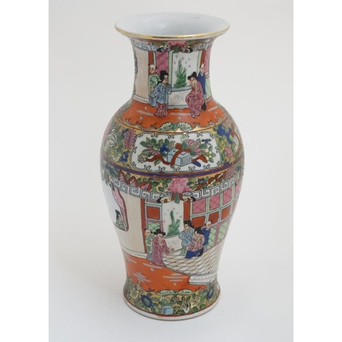 429 - A Chinese famille rose flared rim vase in a Cantonese style , the body decorated with exotic birds a... 