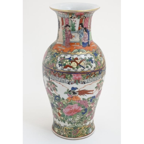 429 - A Chinese famille rose flared rim vase in a Cantonese style , the body decorated with exotic birds a... 