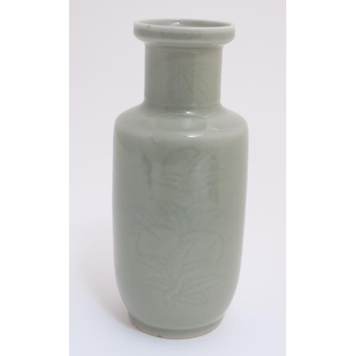 431 - A Chinese green Celadon vase , decorated with incised foliage to side. 9 1/2'' high.